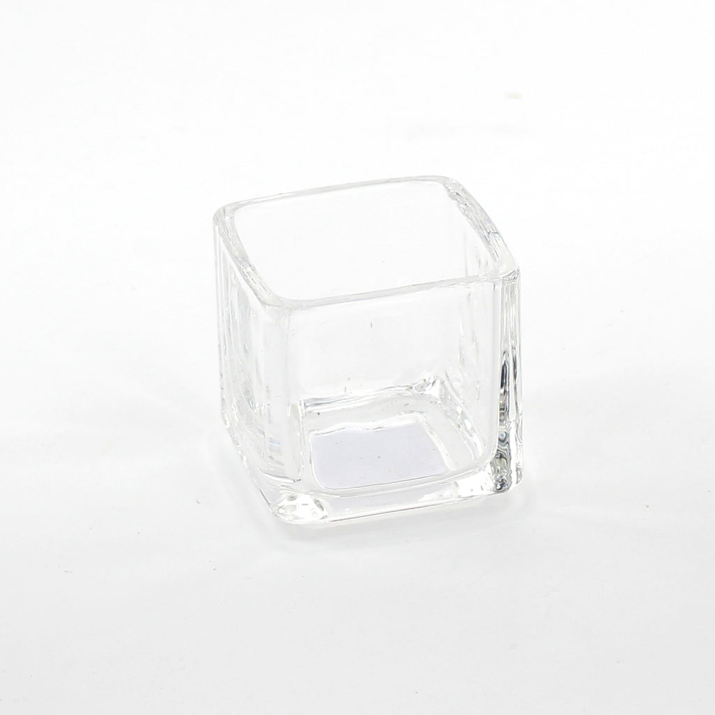 Small clear Seria vase photographed on white by Oomomo Canada.