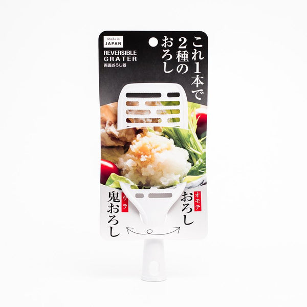 Double-faced vegetable grater with a standable handle